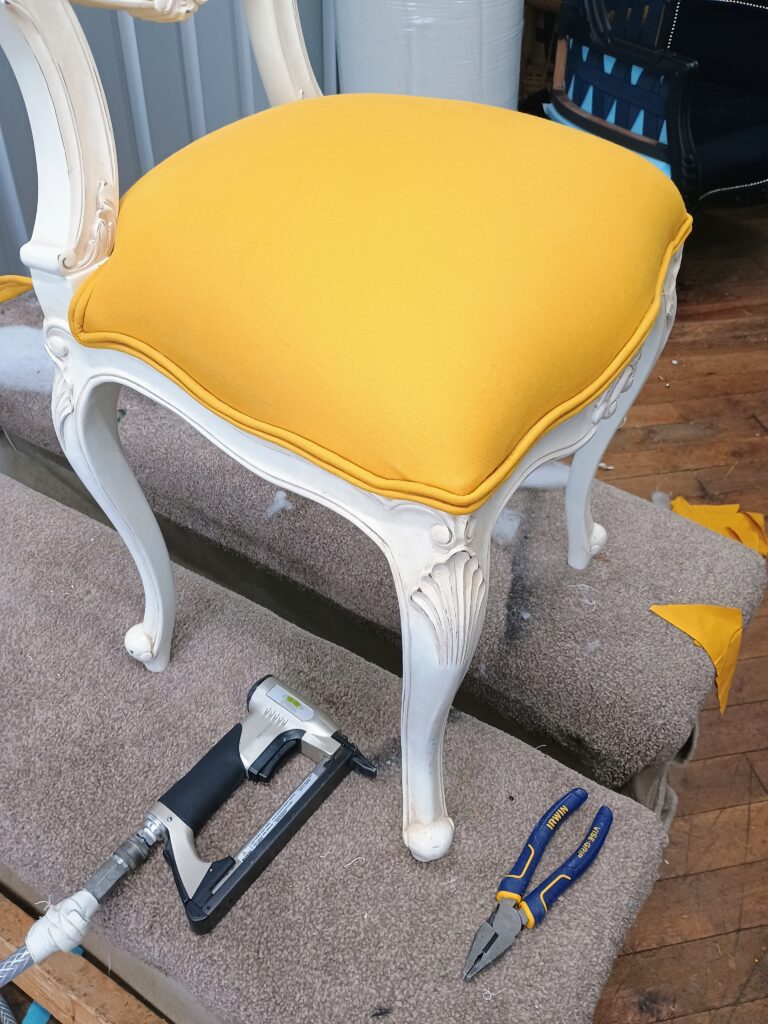 Image of a chair being reupholstered by C Marsden Upholstery services - Bolton